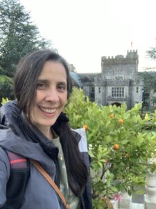 Smiling woman in front of Royal Roads.